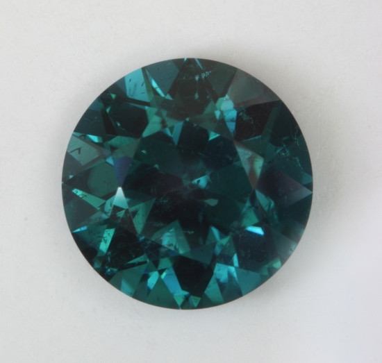 Darker blue to blue green flash driven color, included round. #124
