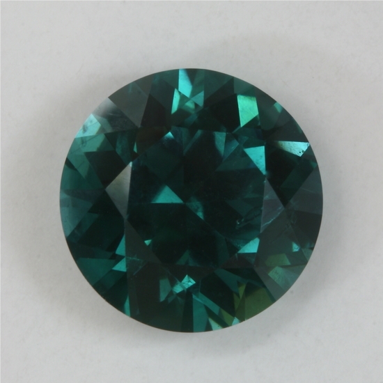 In its medium dark tone range this blue to blue green round is a GEM. #132