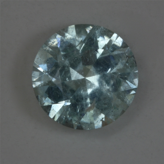 A galaxy of small white inclusions in a pastel blue green, Icet, round. #134