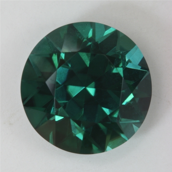 Excellent medium dark blue to blue green round. GEM #142