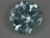 A galaxy of small white inclusions in a pastel blue green, Icet, round. #134