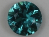 A round with a signifcant white flaw, but great blue color. #143