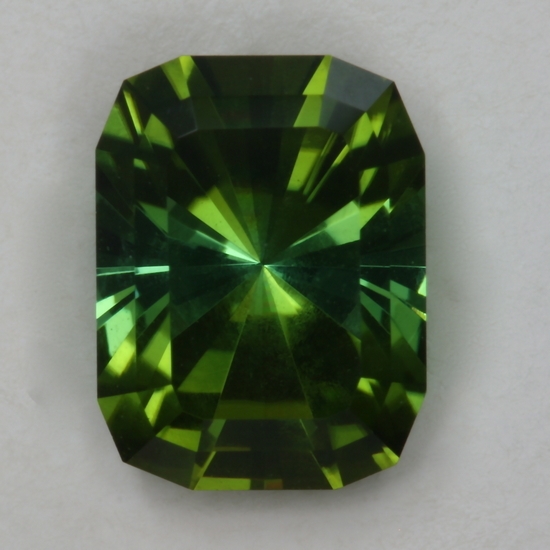 A fine Barion cushion cut that blends the  dichroic greens beautiful.  #164