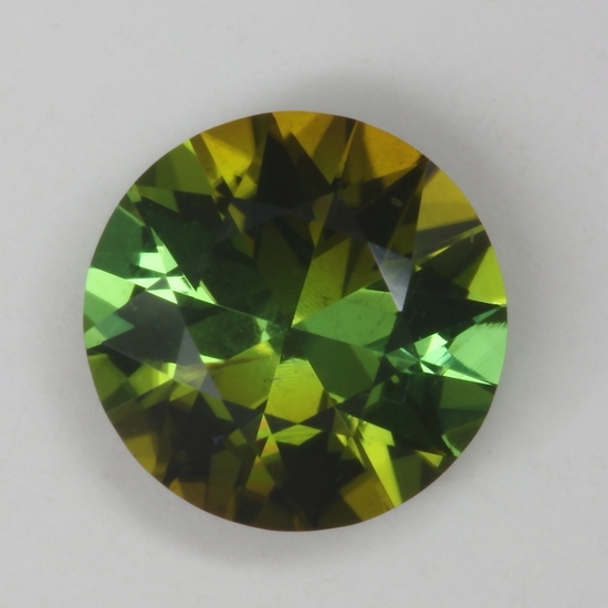 Dichroic, pie slices of golden green and green round.  #173