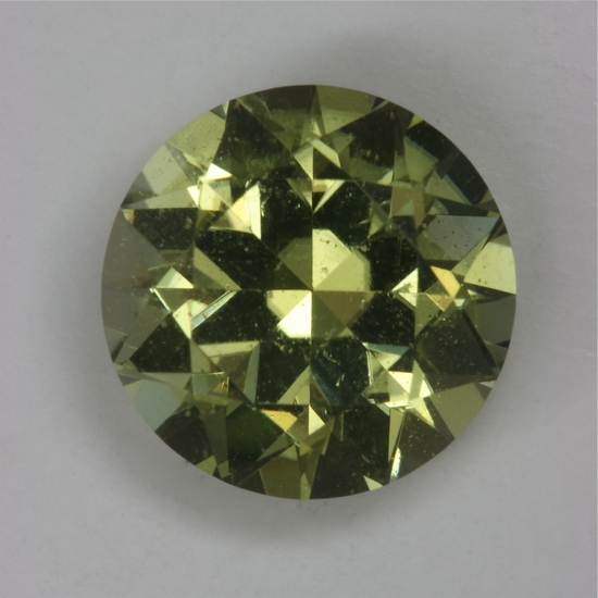 A mostly yellow with a wash of green, cuprian round.  #182