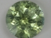 Included, lightly toned yellow green droplet of color.  #152