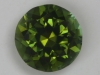 A medium dark green with touch of gold, cuprian, droplet of color.  #165