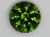 A medium toned, slightly included green, cuprian droplets of color.  #175