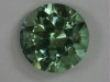 Included standard round brilliant with medium toned green color #221