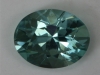 Minty blue green oval with slight edge inclusion. #0238