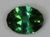 Flashy dichroic green oval. #239