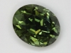 A fine bright flashy green oval. #244