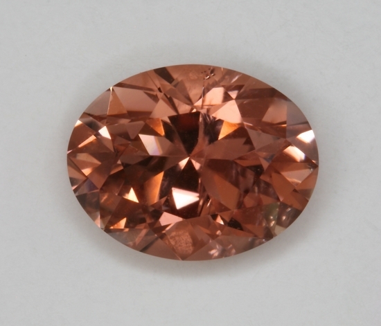 A bright, flashy,  filled with a dynamic yellowish salmon color, oval.  #287