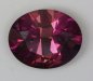 A fine dichroic pink with a purplish cast oval.  #274