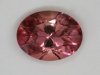 Dichroic oval with darker ends.  Medium pastel peachy pink color.  #277