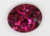 Slightly included, pink witha  wash of purple, oval, #294