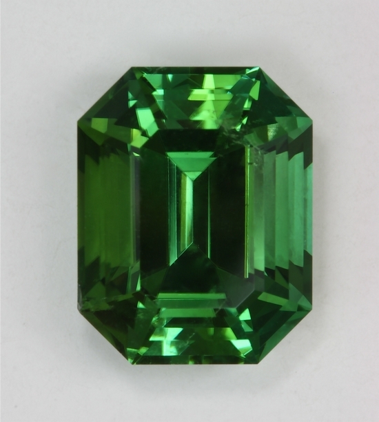 This is a GEM green emerald cut.  #319