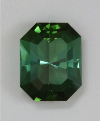 Pavilion has a radiating flash cut in an emerald cut shaped green.  #374