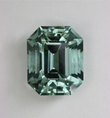 Lightly toned,  non dichroic. eye clean, blue green,  emerald cut.  #386