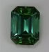 Moderately dichroic emerald cut with darker green ends and bluer sides.  #369