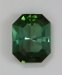 Pavilion has a radiating flash cut in an emerald cut shaped green.  #374