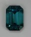 Excellent, open ended, slight dichroism, blue emerald cut.  #385