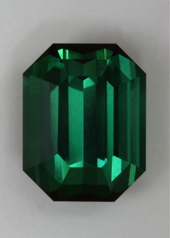 Beautiful, semi closed, well saturated green with touch of blue emerald cut  #411