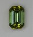 Bright, open end, slightly dichroic, acid green emerald cut.  #407