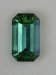 Bright, shifty, open, blue green emerald cut with significant flaw  #412.