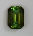 Bright completely open dichroic green and bronze emerald cut.  #417