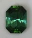 Moderately toned, bluish green hexagonal cut.  #422