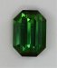 Slightly included, medium dark toned, green emerald cut  #424