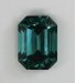Slight dichroic medium toned blue with touch of gray emerald cut.  #430