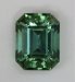 A completely open, slightly dichroic, pastel blue green emerald cut.  #439