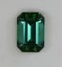 Medium plus tone level in an open ended green emerald cut.  #440