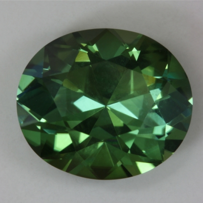 oval included blue green tourmaline gem