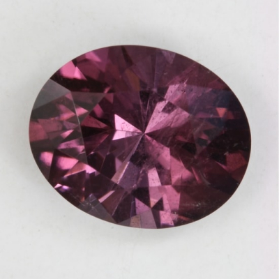 non-copper red purple oval included tourmaline gem