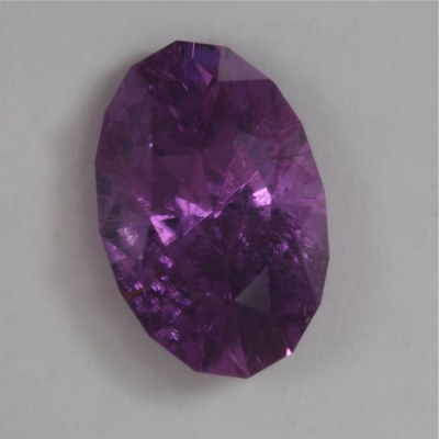 oval included purple copper tourmaline gem