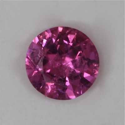 brilliant hot pink included tourmaline gem