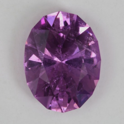 oval purple copper included tourmaline gem