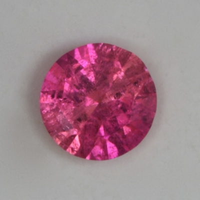 round included hot pink tourmaline gem